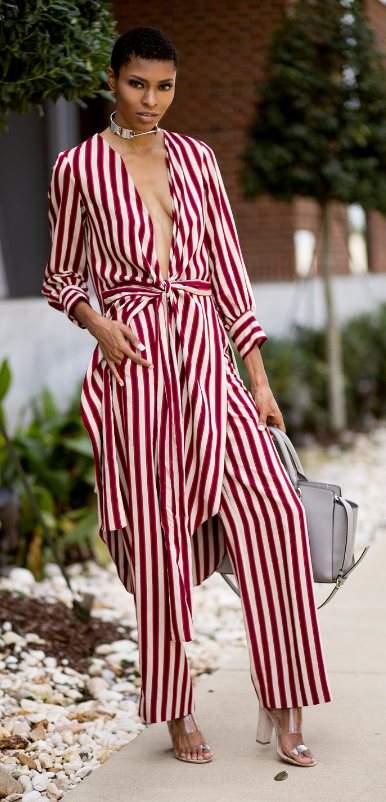Burgundy-striped tie-front jumpsuit with clear heels and grey handbag